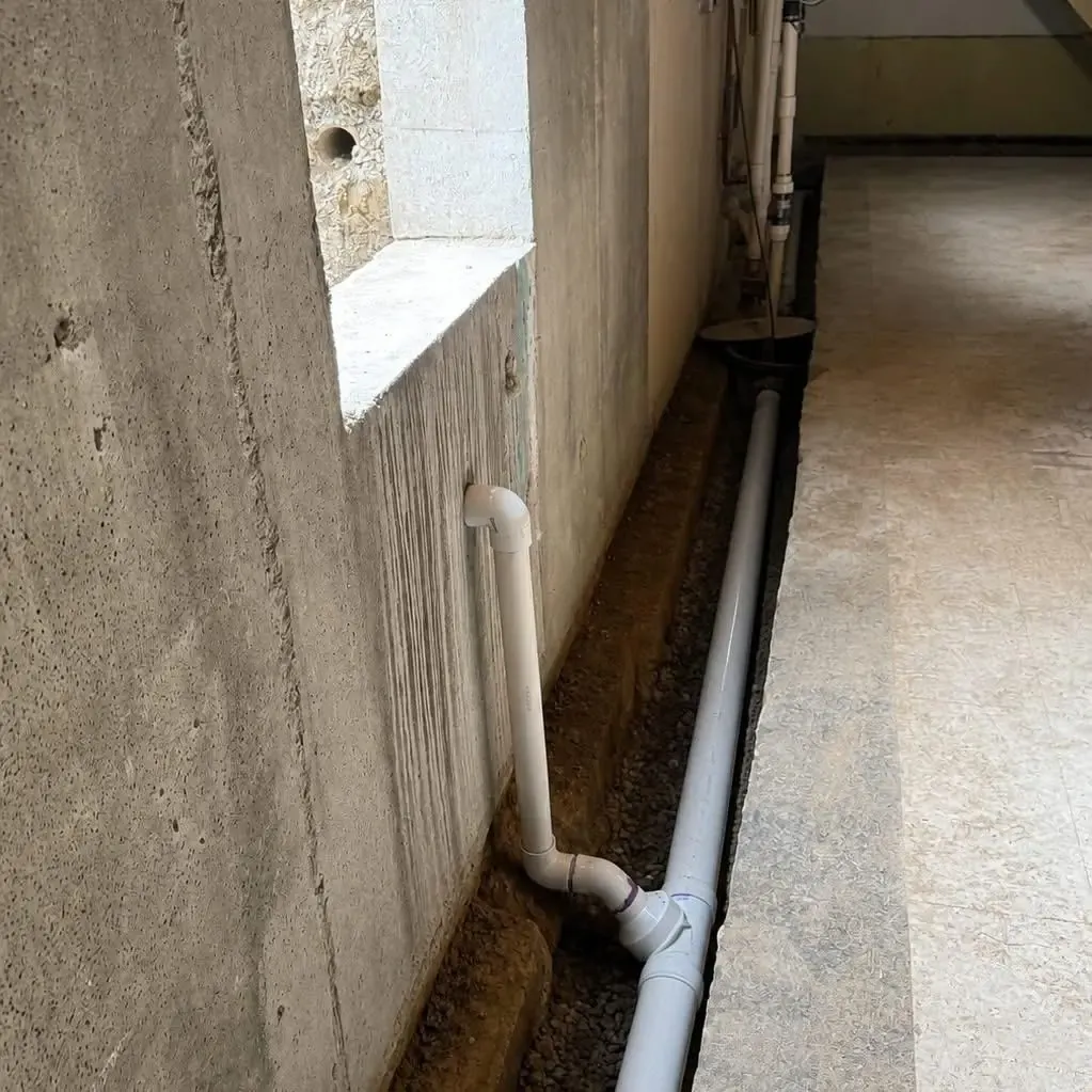 Drainage pipe trench in a residential basement